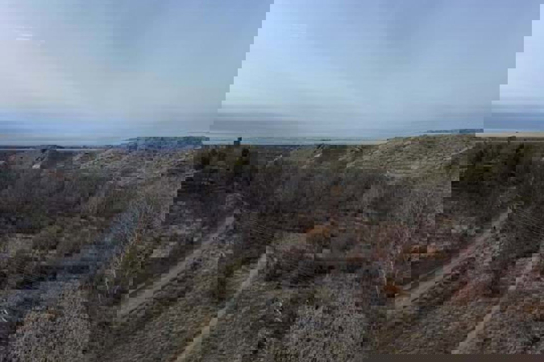 Aerial view of Curlew Connection Trail with overhead powerlines.